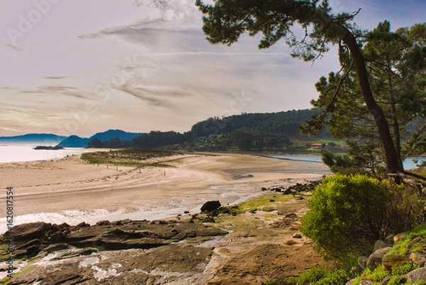 Fototapeta Escape to untouched beauty on the Cíes Islands, Galicia, Spain—turquoise waters, forest trails, and mountain views. A dream destination for nature lovers and summer adventurers.