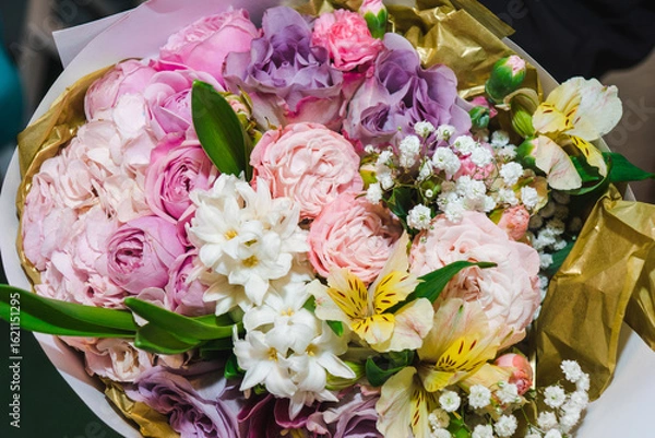 Obraz Flower arrangement background. Mixed bouquet of various types of flowers and colors. Delicate pink peonies and roses wih yellow alstroemeria bordered wiht gypsophila.