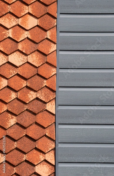 Obraz Hexagonal red clay tiles next to plastic grey surface.