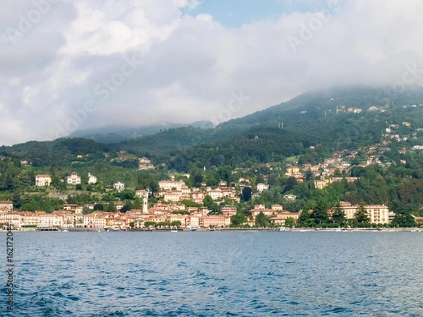 Fototapeta Menaggio, Italy - august 25, 2015: Menaggio view with perspective and from the ferry landing stage