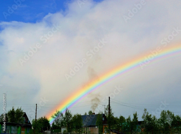 Obraz яркая радуга над дачными домиками.