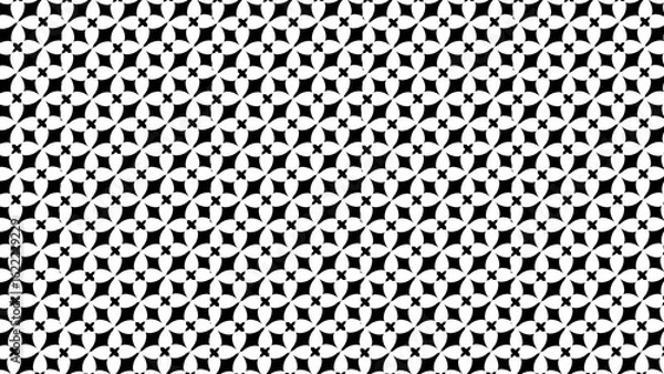 Obraz A black and white geometric pattern with repeating floral and diamond shaped elements throughout the image