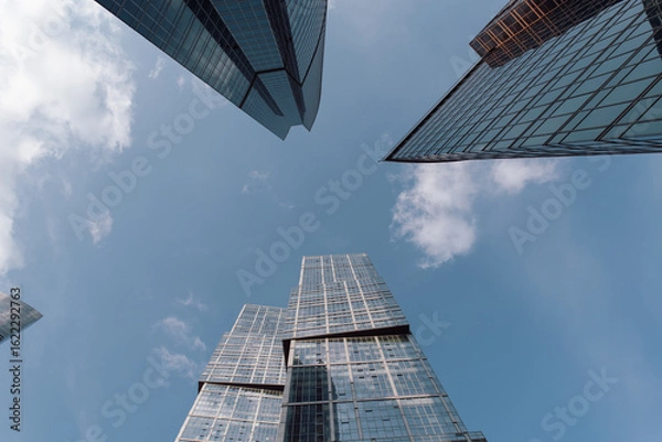 Fototapeta bottom view of the tall skyscrapers of the business district of a modern city