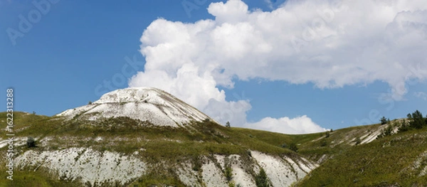 Fototapeta Natural landscape with chalk hills under the cloud sky