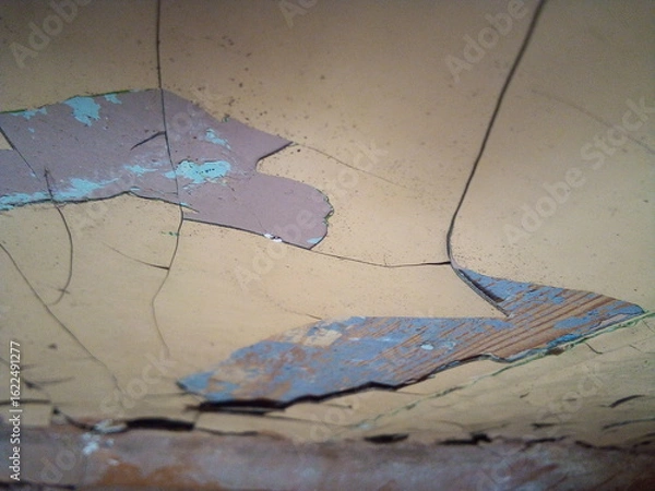 Fototapeta Old paint with cracks on the wall. Background for design