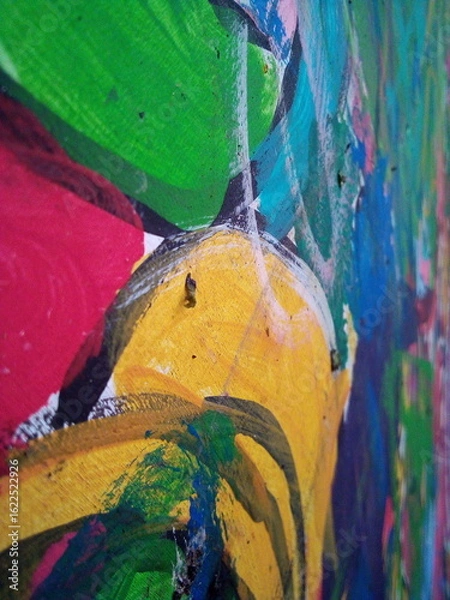 Fototapeta Smearing paint on the wall. Children learn to paint with oil paints. Background for design.