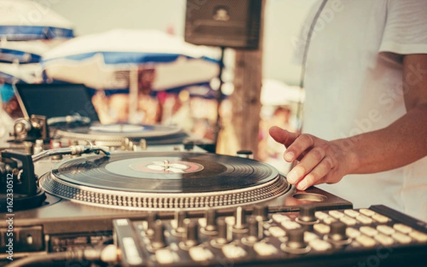 Fototapeta Summer beach party - DJ playing from records