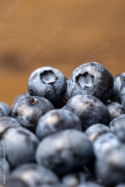 Fototapeta Fresh ripe blueberries close up with natural texture and bloom. Organic fruit and healthy food concept. Macro shot photography.