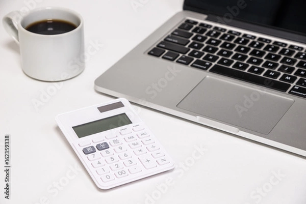 Obraz Laptop computer with calculator and coffee - パソコンと電卓とコーヒー