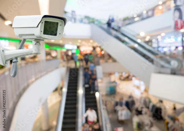Obraz CCTV camera in shopping mall. security camera shopping mall on blurry background