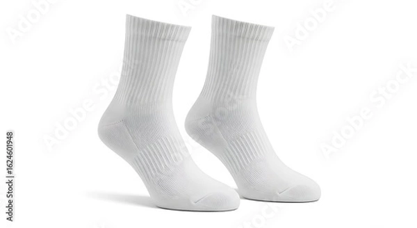Fototapeta A pair of classic white ribbed crew socks standing upright, isolated on a clean white studio background.