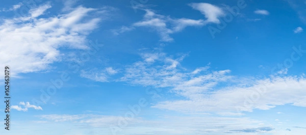 Fototapeta Panorama of blue sky background with white clouds on a sunny day