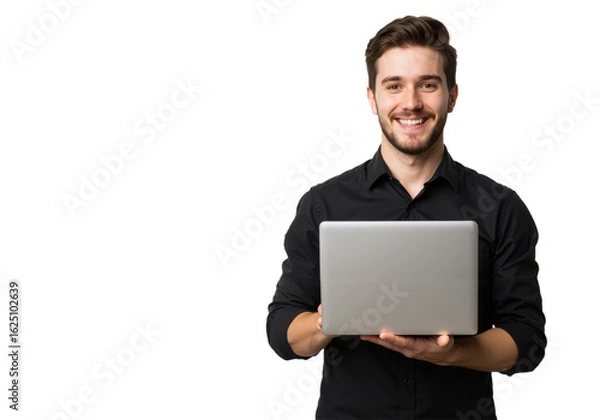 Fototapeta A smiling young man in a black shirt cradles a laptop against a white backdrop, showcasing a polished and approachable look.