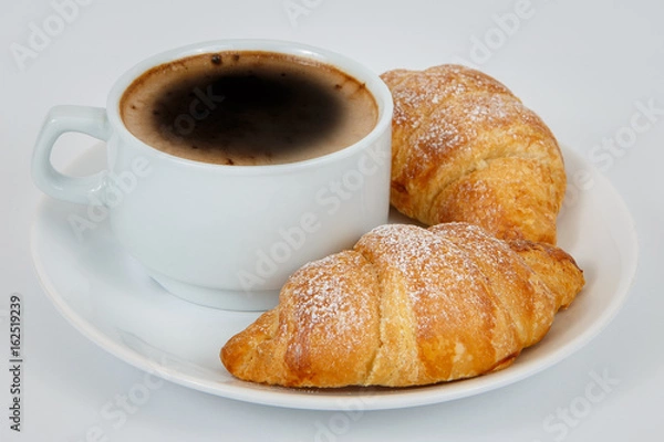 Fototapeta Lush croissants with fragrant coffee for breakfast