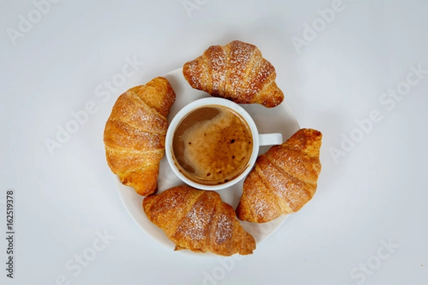 Fototapeta Lush croissants with fragrant coffee for breakfast