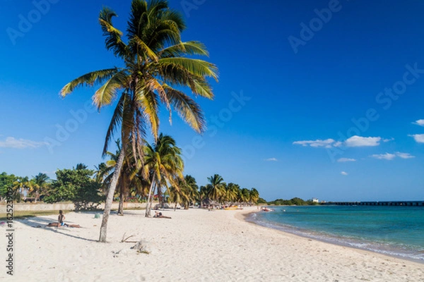 Fototapeta PLAYA GIRON, CUBA - FEB 14, 2016: Tourists at the beach Playa Giron, Cuba. This beach is famous for its role during the Bay of Pigs invasion.
