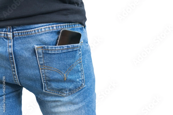 Fototapeta Black smartphone in the right back pocket of jeans isolated on white background with clipping mask.