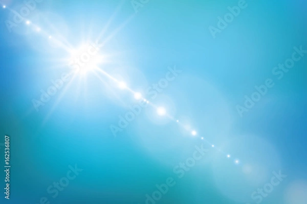 Fototapeta Lens flare in the afternoon on blue sky background