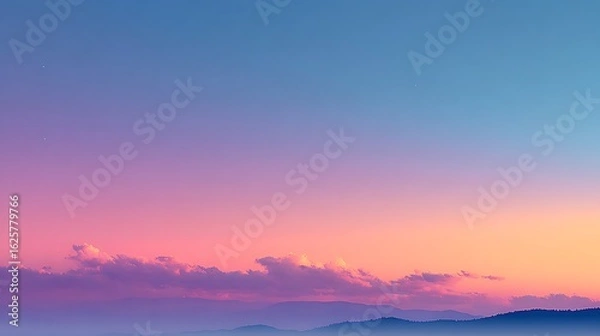 Fototapeta Soft Pink and Orange Sunset Sky Over a Distant Mountain Range