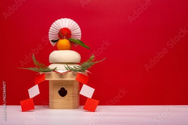 Fototapeta 本物のお餅“鏡餅"を左側に配置した写真　紅白背景　三宝(台座)あり