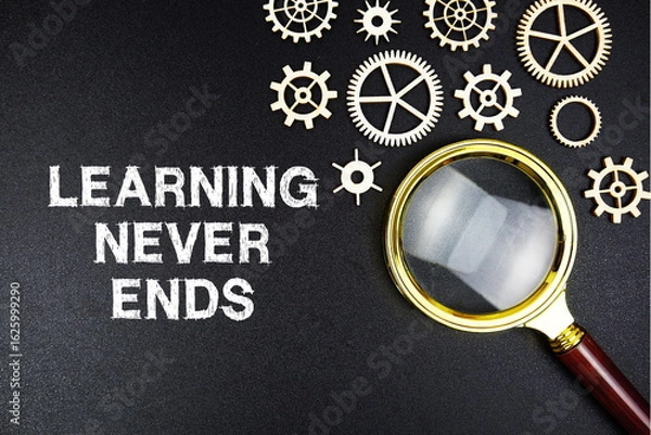 Obraz Learning Never Ends text message with magnifying glass on black background
