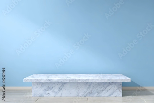 Obraz White marble table surface in front of a smooth blue wall background with clean lighting and blank copy space for design or product display.