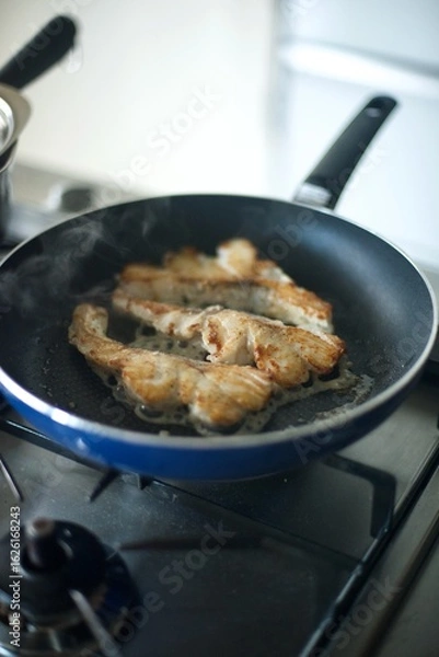 Obraz たらのムニエルを焼いているところ