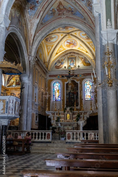 Fototapeta A photo of a church with a large painting on the ceiling