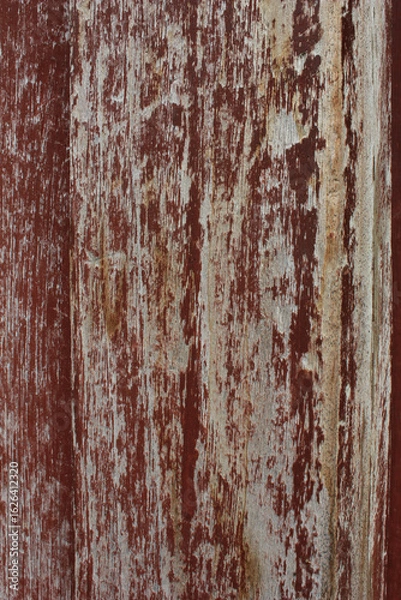 Obraz Cracked Red Painted Wood. Close-up of red painted wood with large cracks and weathered paint, showing deep texture and age.