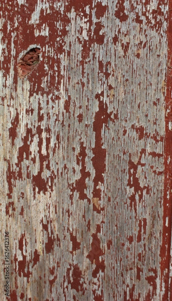 Obraz Cracked Red Painted Wood. Close-up of red painted wood with large cracks and weathered paint, showing deep texture and age.