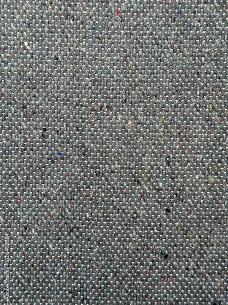 Fototapeta Vertical close-up of dark grey fabric texture background. Rich texture, tight weave gray material. Natural fibers detailed backdrop perfect for t-shirt designs, apparel, and textile projects