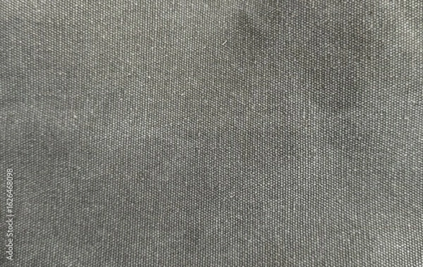 Fototapeta Coarse grey texture background, detailed weave of dark gray fabric horizontal close-up image. Natural fibers cloth backdrop  for fashion, textiles, and creative design