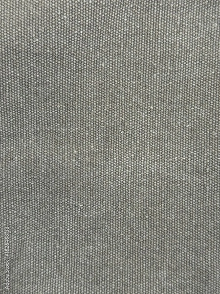 Fototapeta Close-up of grey fabric, vertical wallpaper. Fine weave and texture for textile, fashion, background. Gray fabric texture background for design projects, natural material visuals