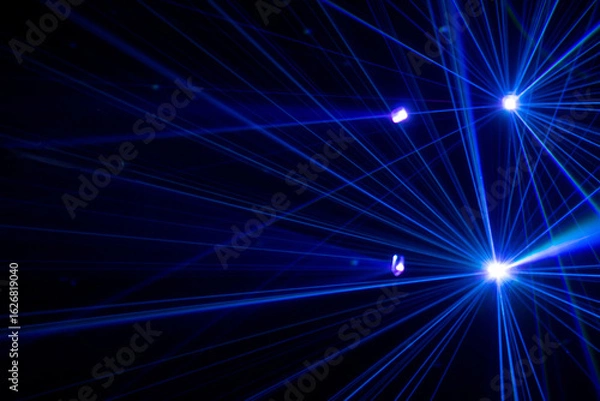 Fototapeta Blue beams in dark background.