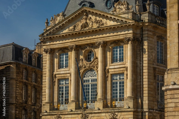 Fototapeta Facade of an elegant historical Palace Building with big Windows,  Columns, and Decorations in Bordeaux, France; Close-up