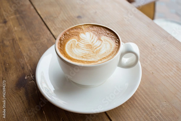 Fototapeta Coffee cup with milk on the table