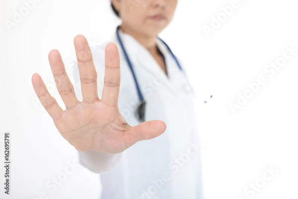 Fototapeta ストップのジェスチャーをする女医
