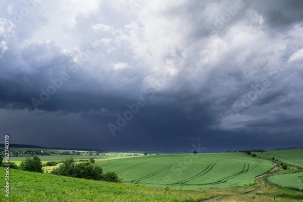 Obraz Approaching summer storm in the field