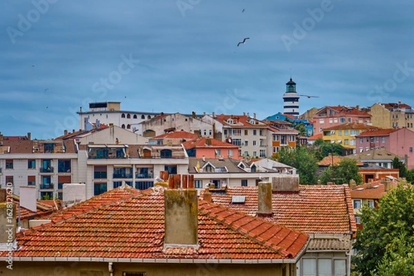 Fototapeta Lighthouse and colorful streets in Sile