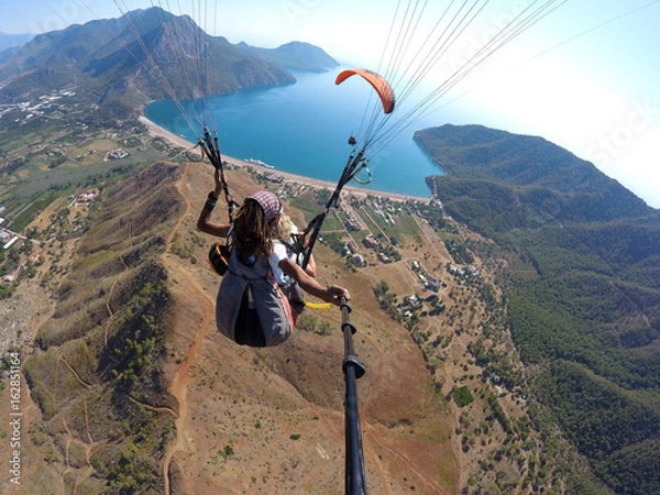 Obraz Leć po niebie nad tandemem laguna Paragliding