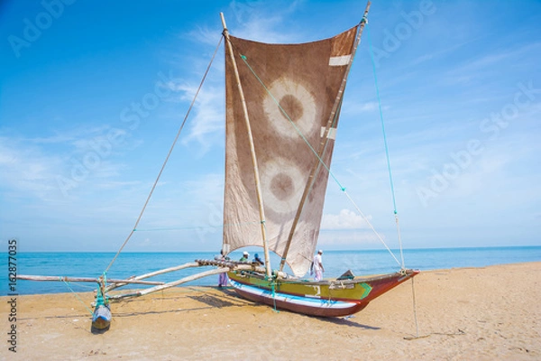 Fototapeta Sri Lankan traditional fishing catamarans in Negombo, Sri Lanka. Negombo is known for its centuries old fishing industry & long sandy beaches