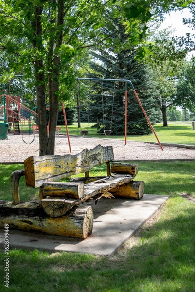 Obraz Rustic log bench at playground