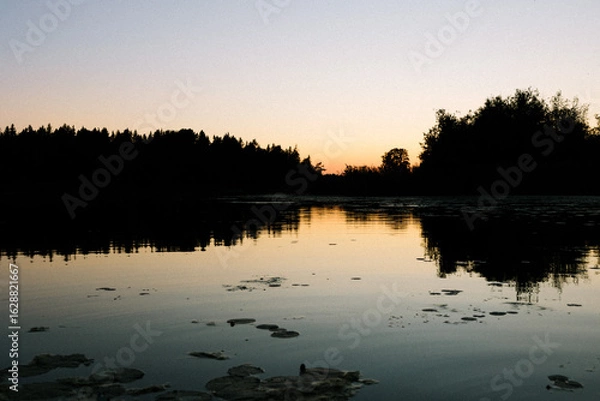 Obraz Sunset over a lake in Sweden
