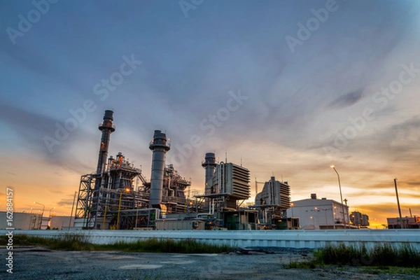 Obraz Gas turbine electrical power plant at dusk with twilight 