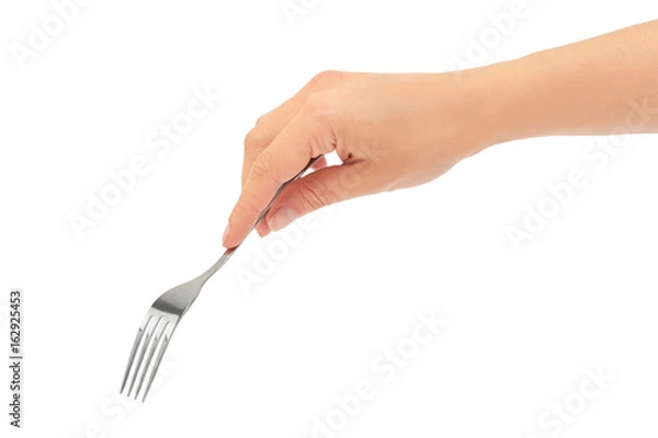 Obraz Female hands hold a fork. Isolated on white background