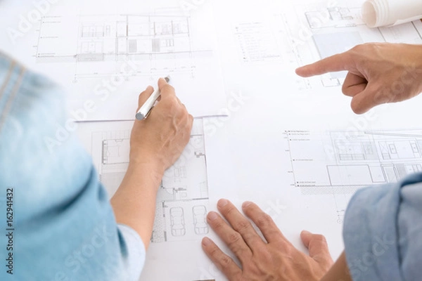 Fototapeta Image of engineer teamwork meeting for architectural project at a workplace