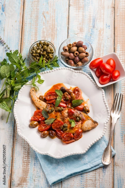 Obraz sword fish with olives capers and tomatoes