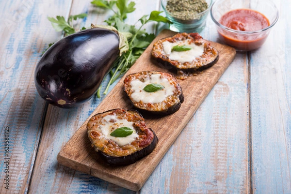 Obraz eggplants mini pizzas with mozzarella and tomatoes