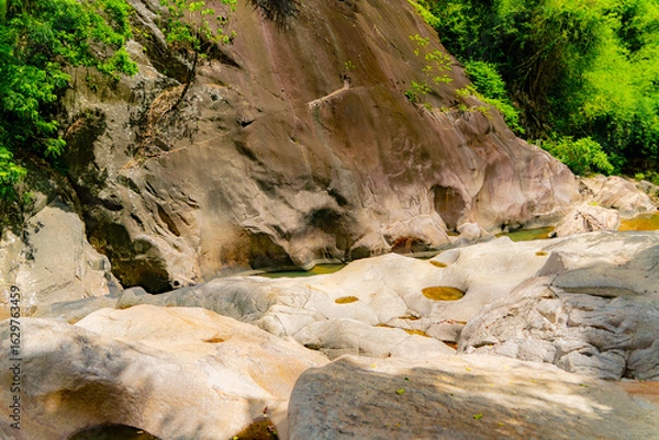 Obraz Stone blocks.

Mountain lakes and rivers of the Baho Falls near Nha Trang in Vietnam. During the rainy season, this place turns into a deep river with large waterfalls.