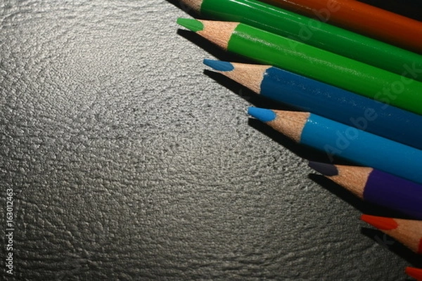 Fototapeta  Photo of crayons on black backdrop